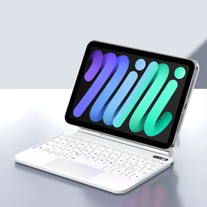 Un iPad Mini blanco con funda de teclado mágico retroiluminada y diseño ondulado colorido.