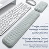 A gray ergonomic keyboard and mouse with a silicone massage wrist pad shown on a white surface.