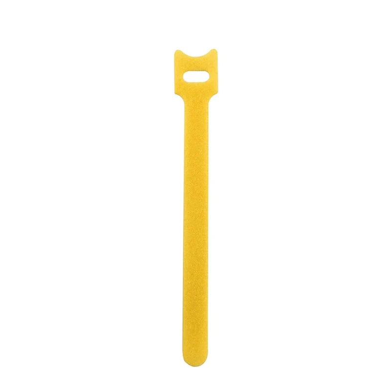 A yellow reusable nylon cable organizer tie with a loop at the top.