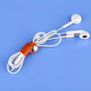 A white faux leather data cable with earphones is displayed on a blue background.