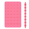 A pink double-sided silicone phone mount grip with multiple circular holes.