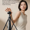 A woman is setting up a black magnetic phone tripod for a smooth, hands-free setup.