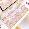 A pink and white cartoon gaming desk mat featuring cute animal characters and food items.