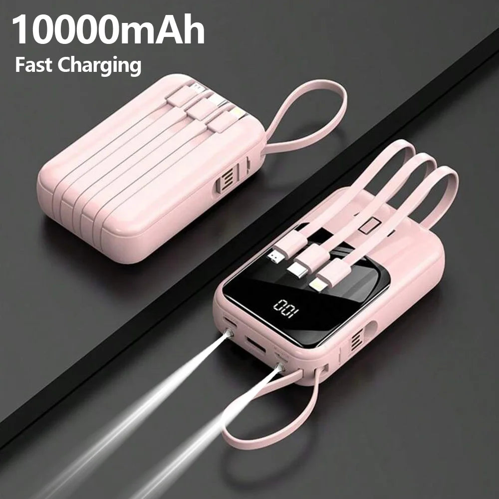 A pink 10000mAh multi-port power bank with a flashlight is shown lying on a dark surface.
