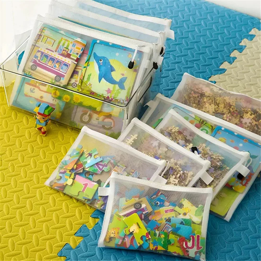 A set of clear mesh storage bags with zippers and colorful contents, displayed on a yellow honeycomb surface.