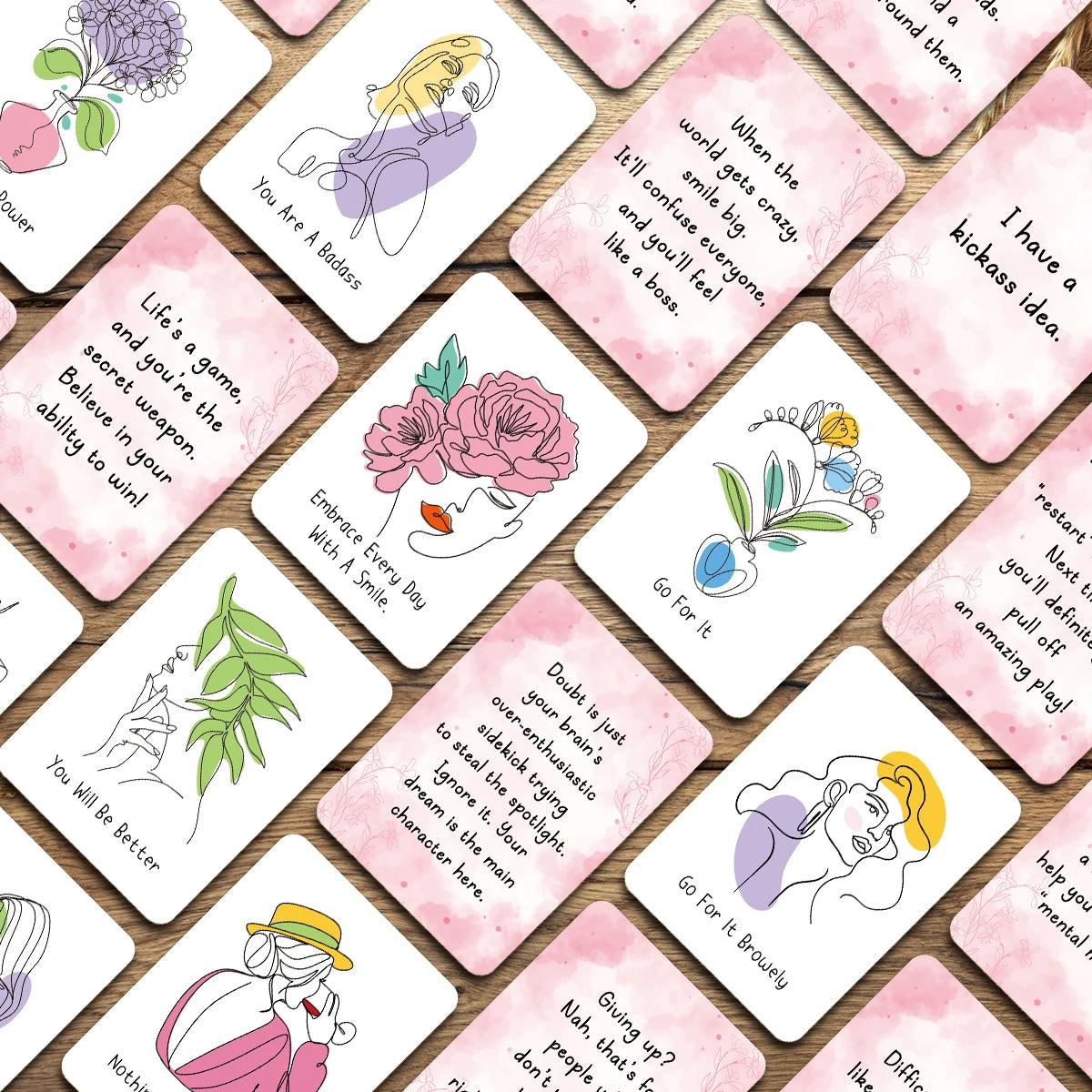 A collection of pink affirmation cards featuring positive messages and illustrations for daily positivity.
