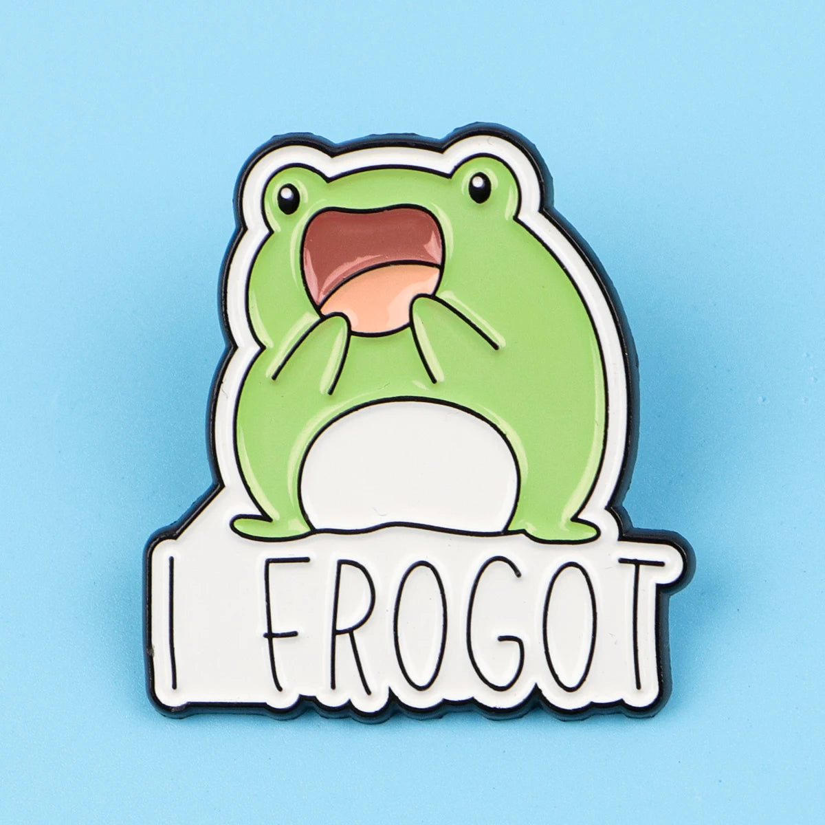 An enamel pin featuring a cartoon frog with an open mouth and a surprised expression.