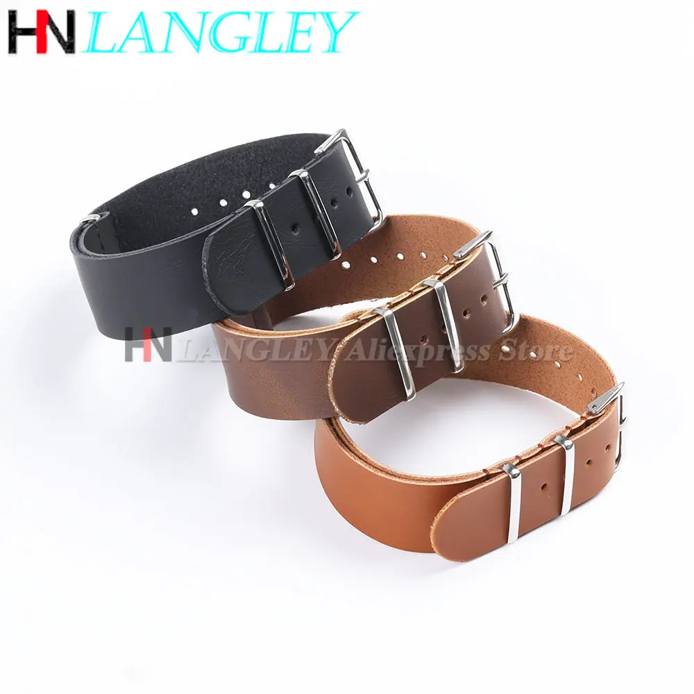 A close-up view of a brown PU leather watch strap with silver buckle details.