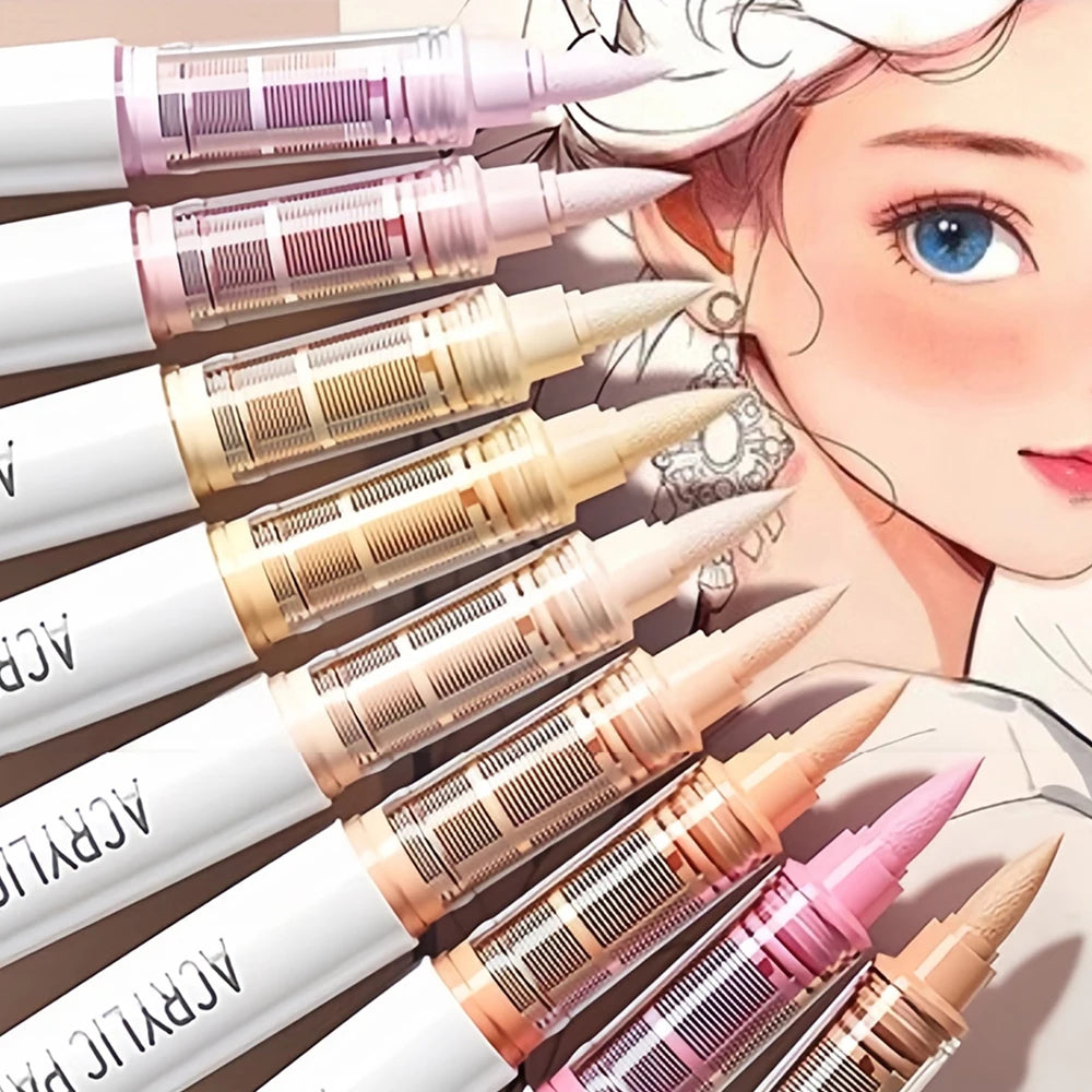 A close-up view of a set of acrylic brush markers with various tips and colors arranged diagonally.