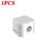 A single white magnetic cable clip designed for desk organization.