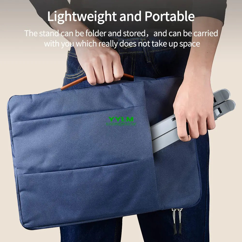 A person is holding a dark blue portable laptop stand designed to be lightweight and foldable.