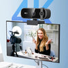 A 4K auto-focus webcam is mounted on a monitor, showing a smiling woman in the background.