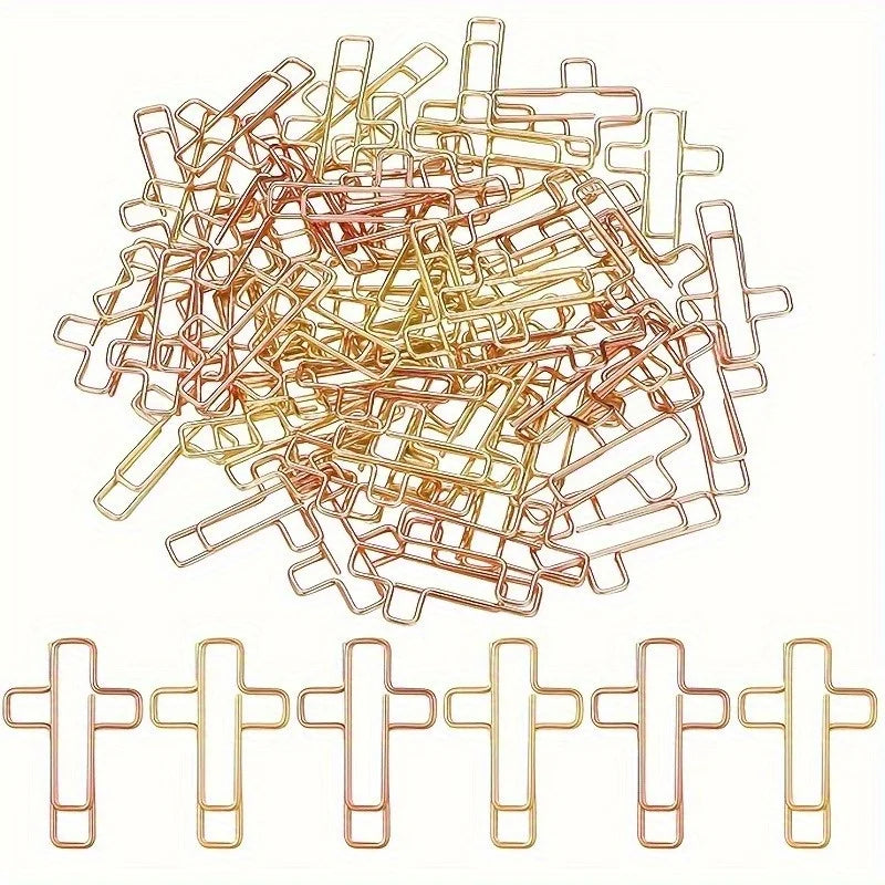 A pile of dual-tone decorative paper clips shown from above and a row of individual clips.