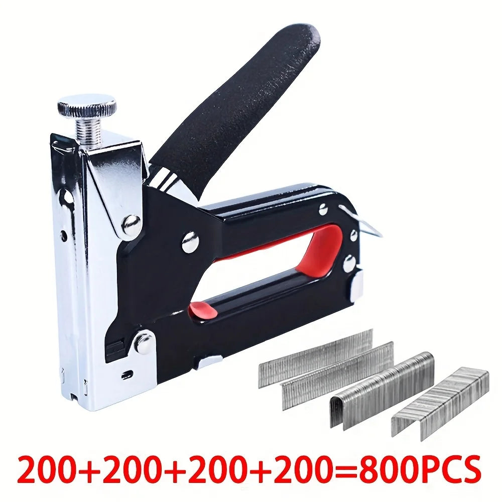 A black and silver heavy duty manual multi-use staple gun with assorted staples shown next to a pile of staples.