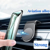 A hand holds a smartphone with an aviation alloy case, demonstrating a strong magnetic car air vent phone mount.