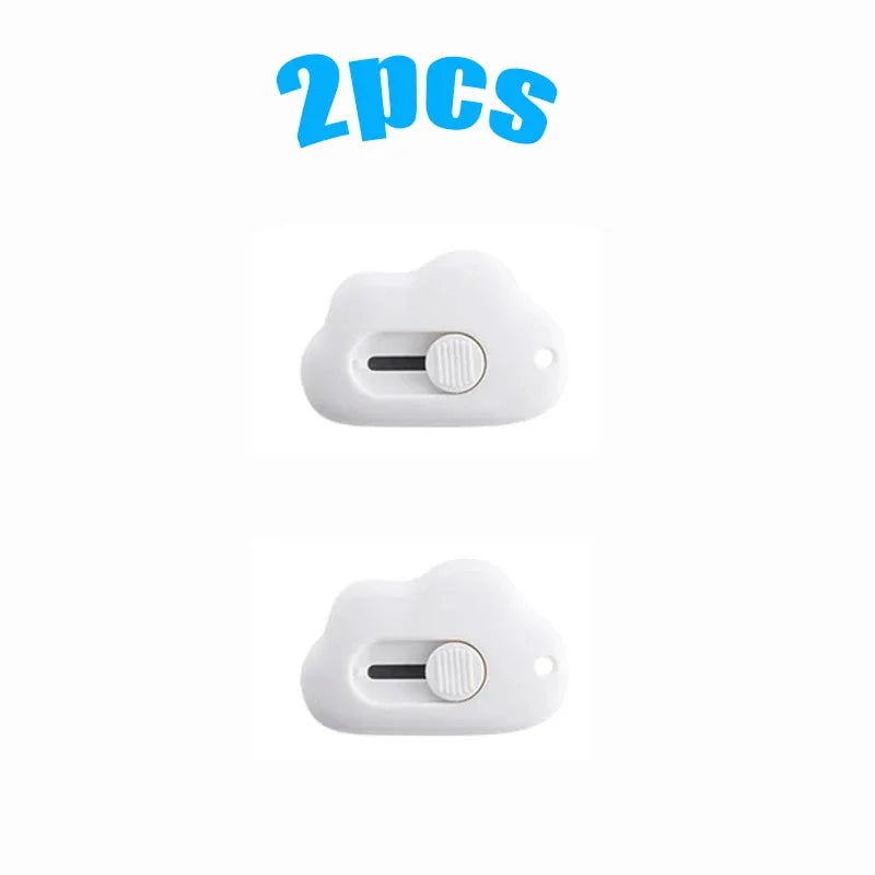 Two white utility knives or openers are shown against a white background.