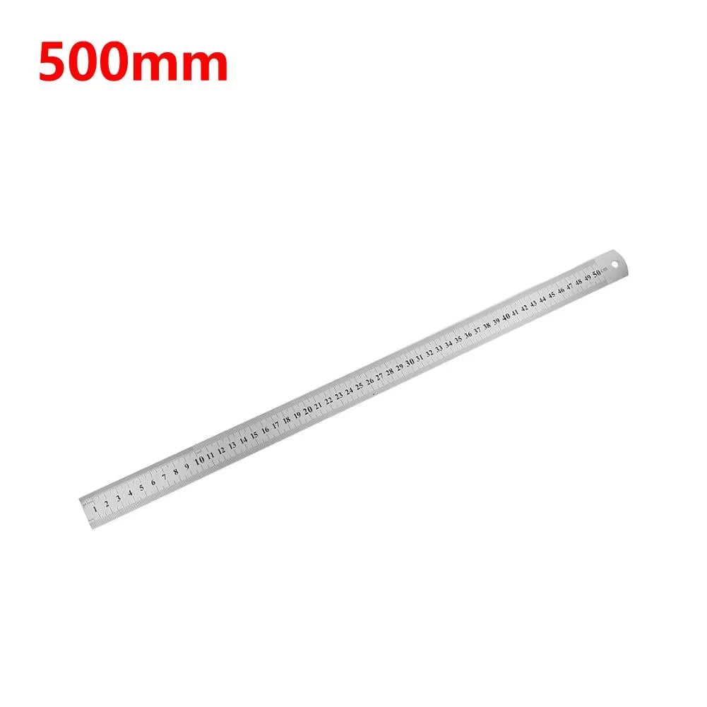 A stainless steel measuring ruler marked in millimeters, showing a 500mm scale.