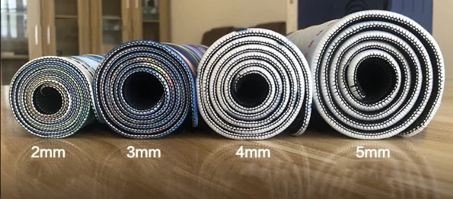 Rolls of extra large rubber desk mat mousepads showing thicknesses from 2mm to 5mm.
