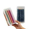 A hand holds a clear storage box filled with colored pencils and other craft supplies.