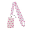 Pink patterned ribbon lanyard with a rectangular tag for ID badges and accessories