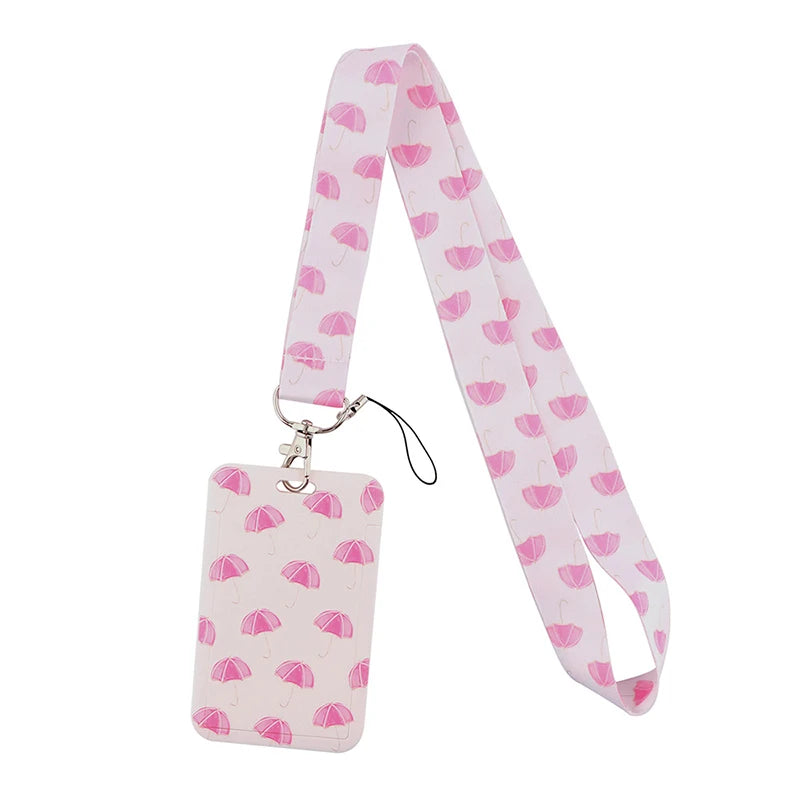 Pink patterned ribbon lanyard with a rectangular tag for ID badges and accessories