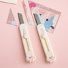 Two white portable pet claw tools with gray blades are displayed on a pink background next to a patterned card.