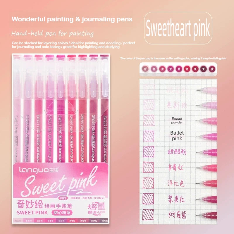 A set of pink painting and journaling pens in various shades, including sweet pink, displayed next to a grid paper.
