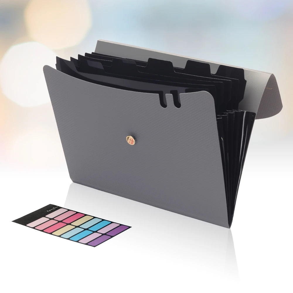 A gray A4 accordion file organizer with an elastic closure and a color swatch displayed in front of it.