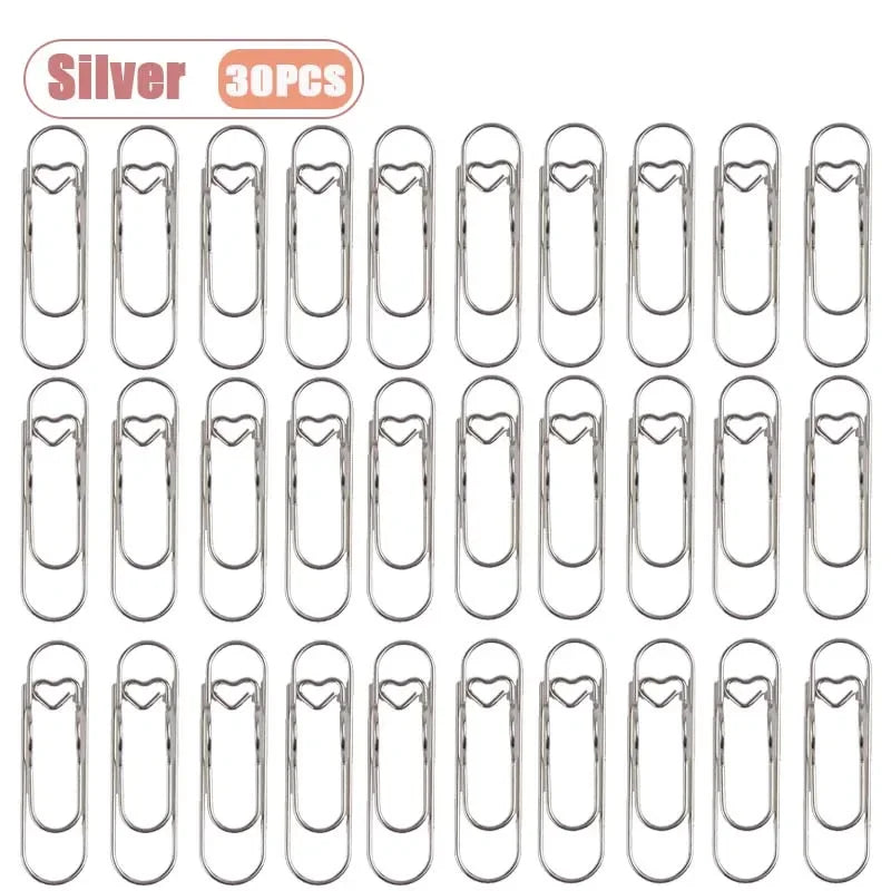 Silver metal pen clips for notebooks and journals, sold in a pack of 30 pieces.