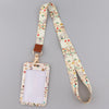 A beige floral patterned fashion lanyard strap with a rectangular ID badge holder attached.