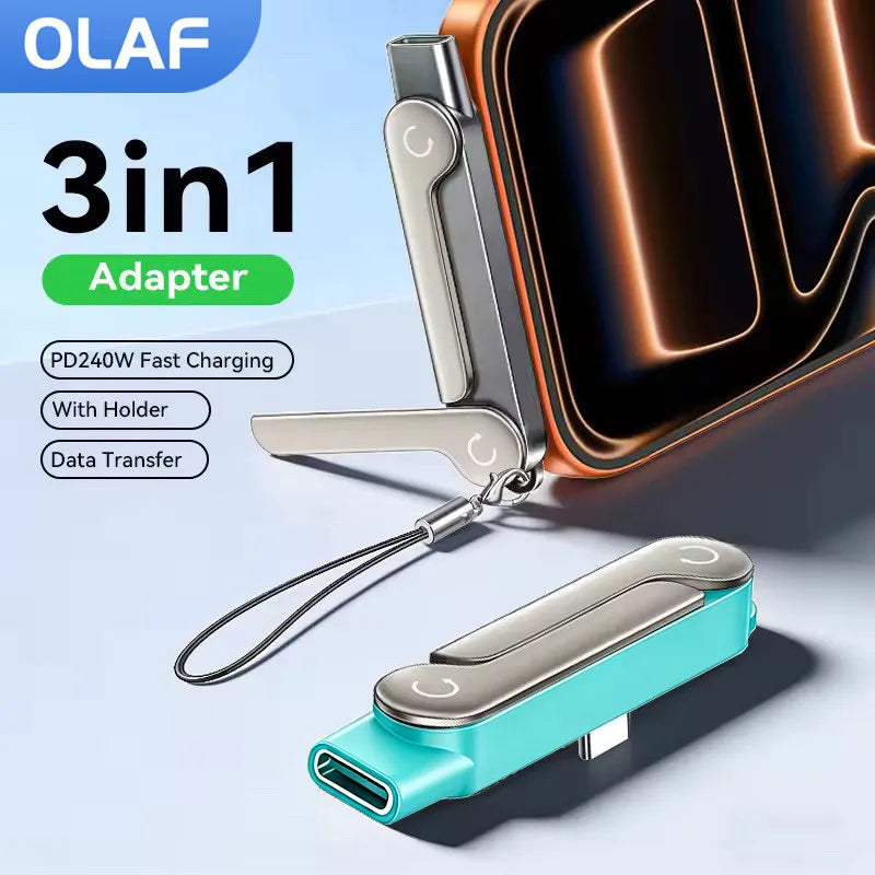 A silver USB-C adapter with a foldable stand and keychain is shown next to a dark phone case.
