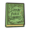 A green enamel lapel pin shaped like an open book with the words Support Public Libraries engraved on the cover.