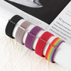 A collection of colorful nylon loop watch straps in various shades and textures displayed on a white background.