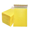A stack of yellow bubble mailers with self-sealing padded envelopes is shown.
