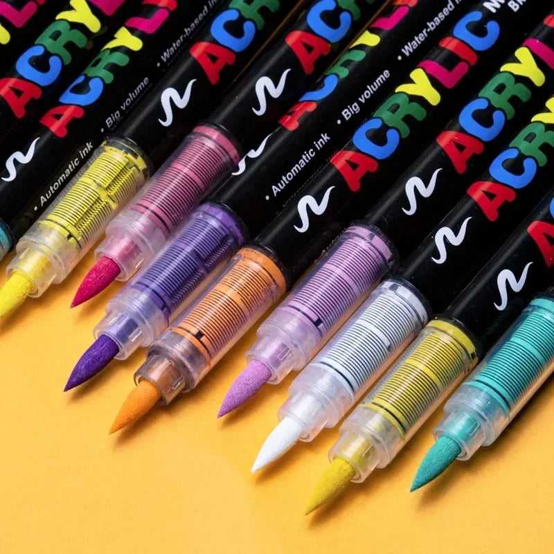 A collection of black paint markers in various colors, including purple, orange, and green, displayed diagonally.