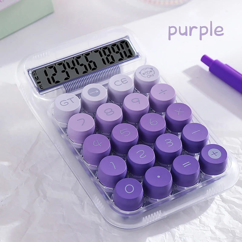 A clear plastic case containing purple dopamine gradient calculator buttons and a purple pen.