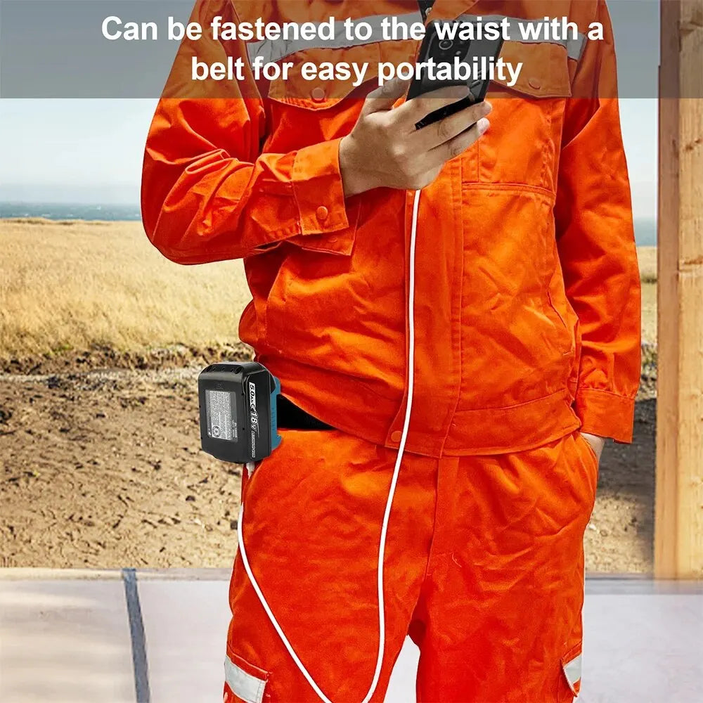 An orange jumpsuit is shown with a white cord attached, featuring a black adapter clipped to the waist.