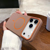 A hand holds a beige magnetic wireless charging phone case with a clear back and three camera lenses.