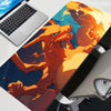 An XXL Gengar gaming mouse pad featuring a vibrant orange and blue dragon print on a desk mat.