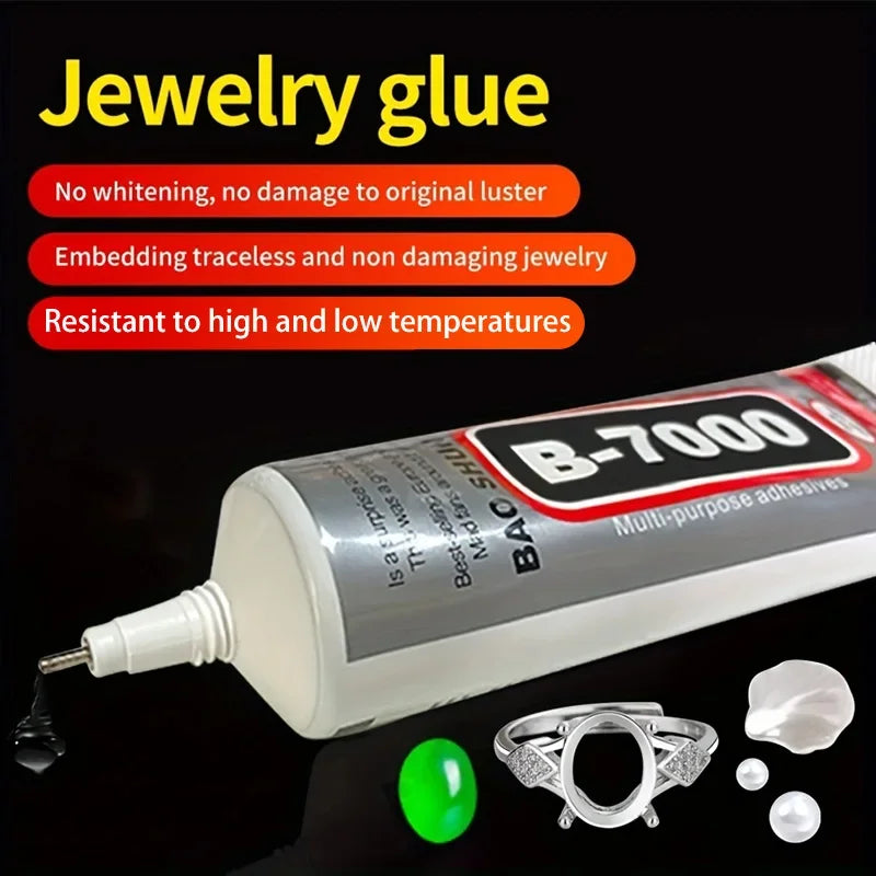 A bottle of B-7000 multi-purpose adhesive jewelry glue with small pieces of silver and white jewelry.