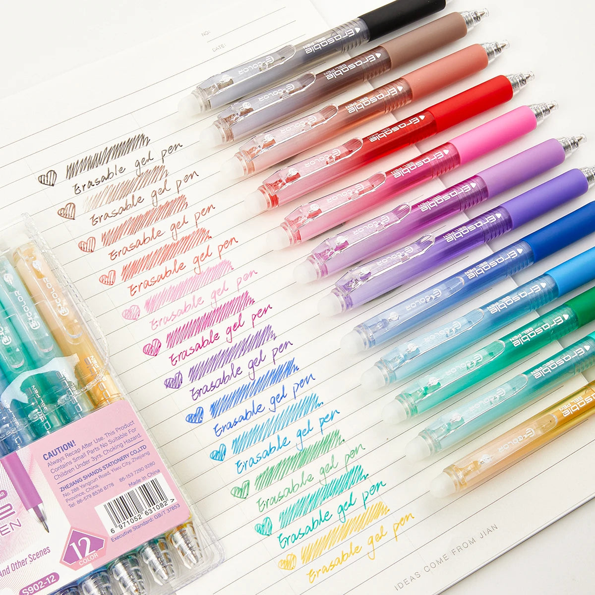A collection of multicolor retractable gel pens in various shades and colors arranged on a white sheet.
