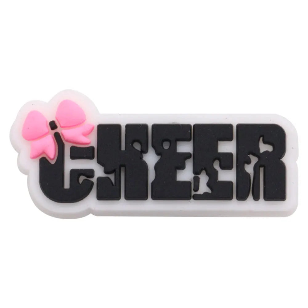 Black and white epoxy charm with a pink flower design and the word CHEER