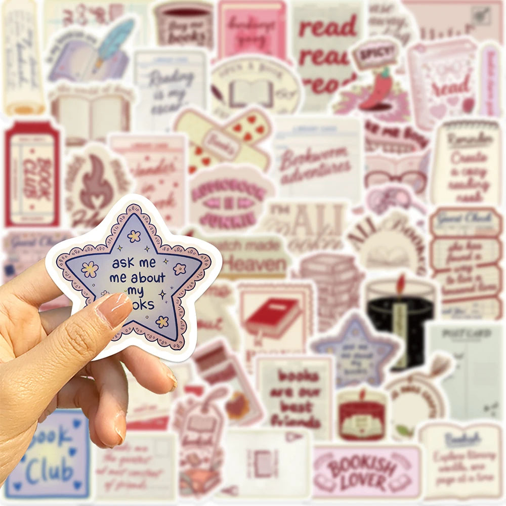 A hand holds a pack of cartoon bookish aesthetic graffiti stickers featuring various literary and reading-themed phrases.