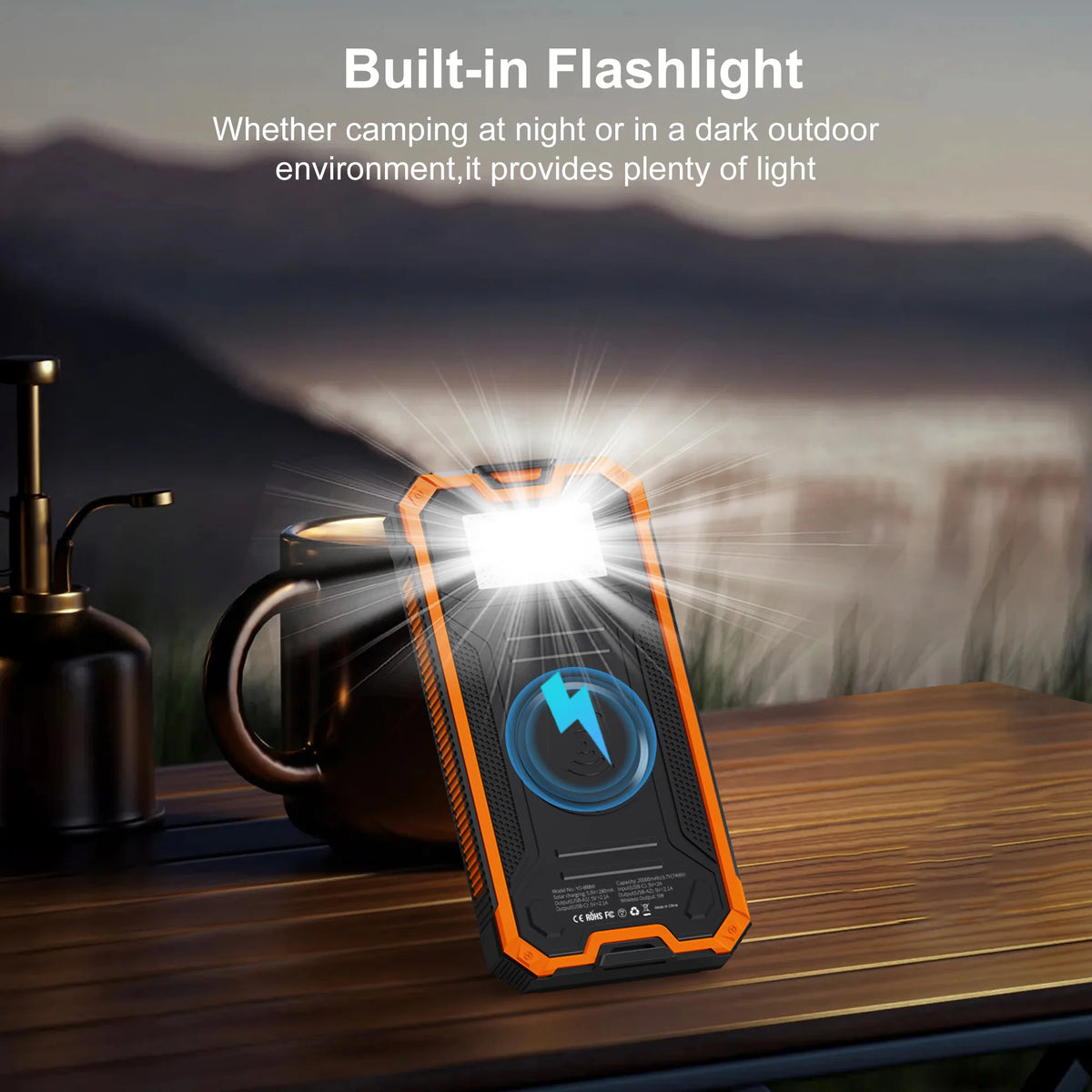 A portable flashlight is shown illuminating a dark outdoor environment next to a mug.