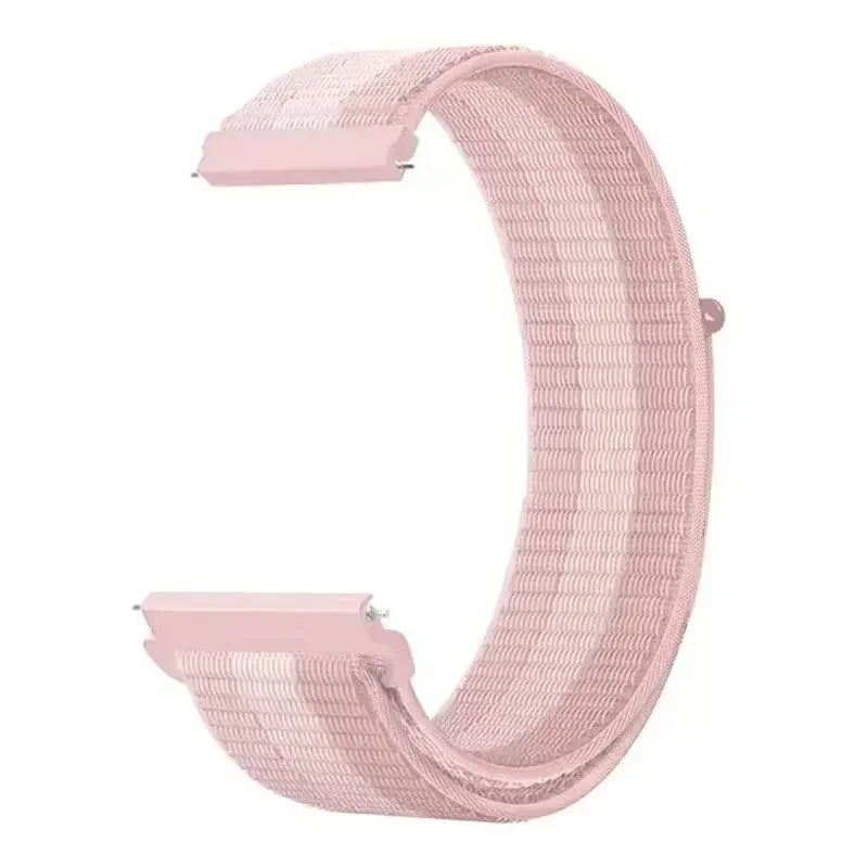 A pink nylon loop watch strap with a textured surface is shown in a curved shape.