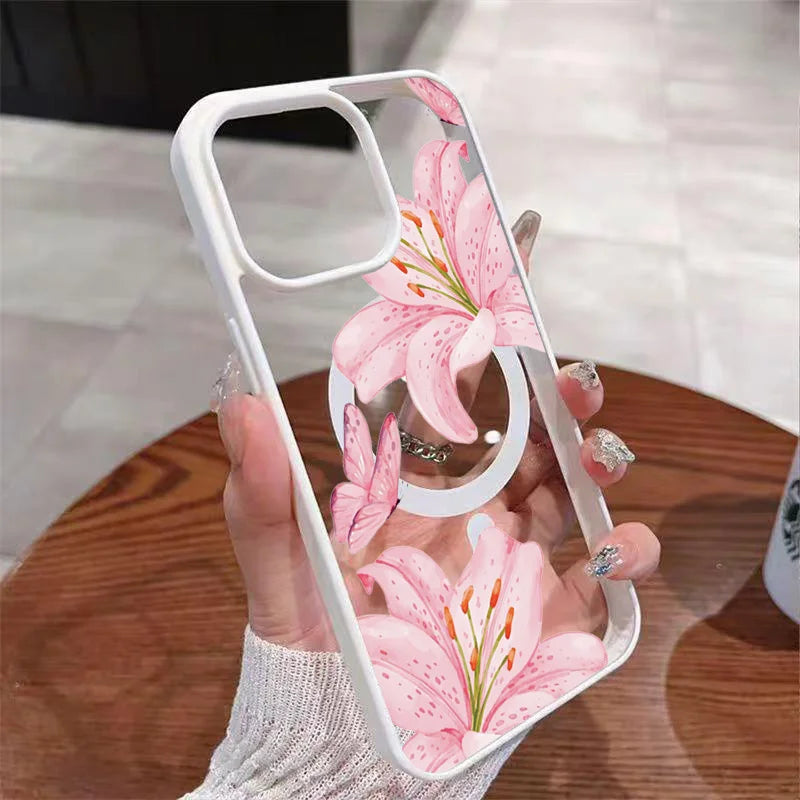 A hand holds a clear pink lily floral transparent iPhone case with a shockproof bumper.