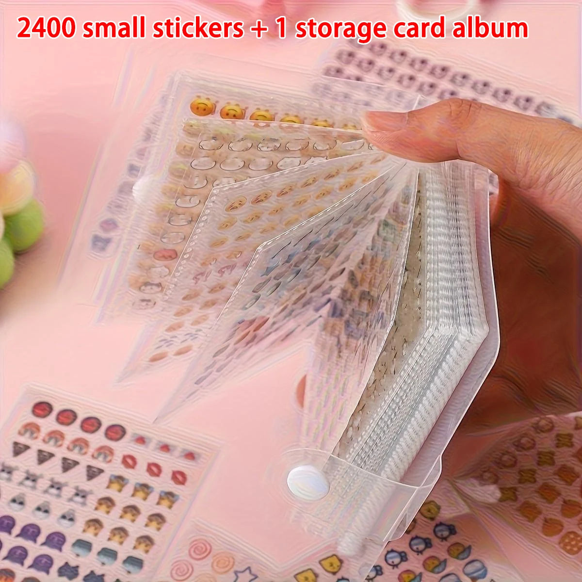A hand is holding a clear storage album filled with 2400 small stickers and an album for crafting.