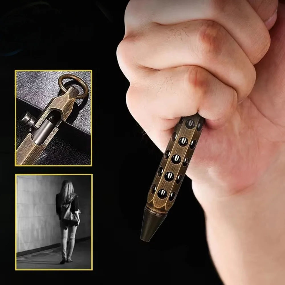 Close-up of a hand holding a brass bolt-action ballpoint pen with a retro design.