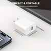 A white compact dual port USB-C fast charger with a Lightning cable is shown on a white surface.