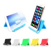 Various colored flexible multi-angle tablet and phone desk stands shown in a row.